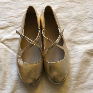 A pair of gold shoes grime Zara